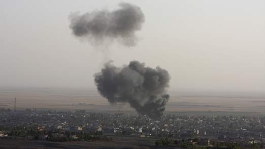 Smoke billows from the town of Makhmur